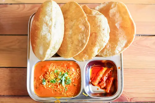 puri bhaji in a plate on table