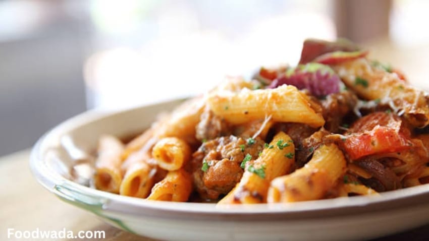 Macaroni in cheesy carrot sauce recipe in a plate